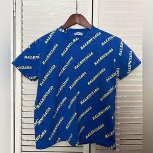 blue t-shirt with yellow inscriptions, size L.  but for S size person.